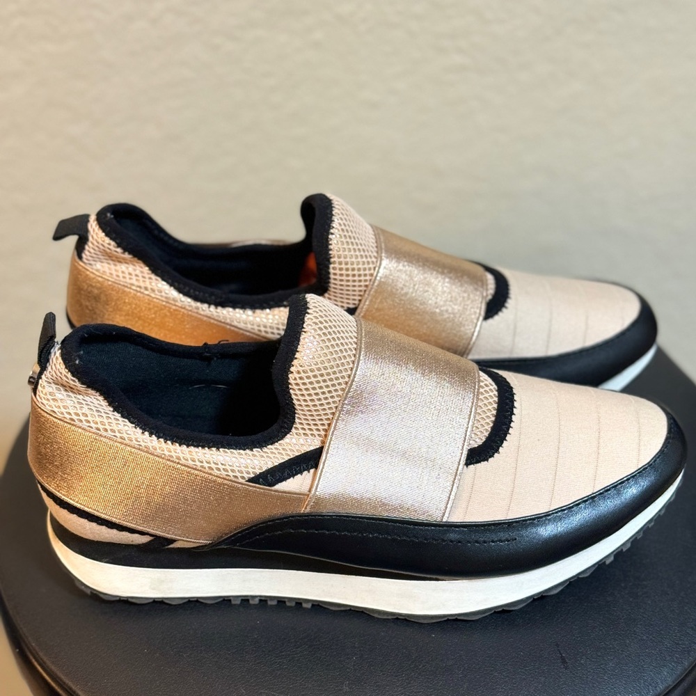 Steve Madden Kyra slip on sneaker in black, gold and cream color.